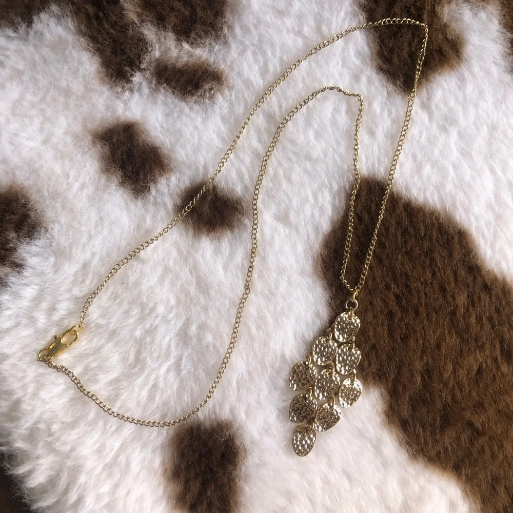 Shiny gold waterfall articulated pendant on chain necklace